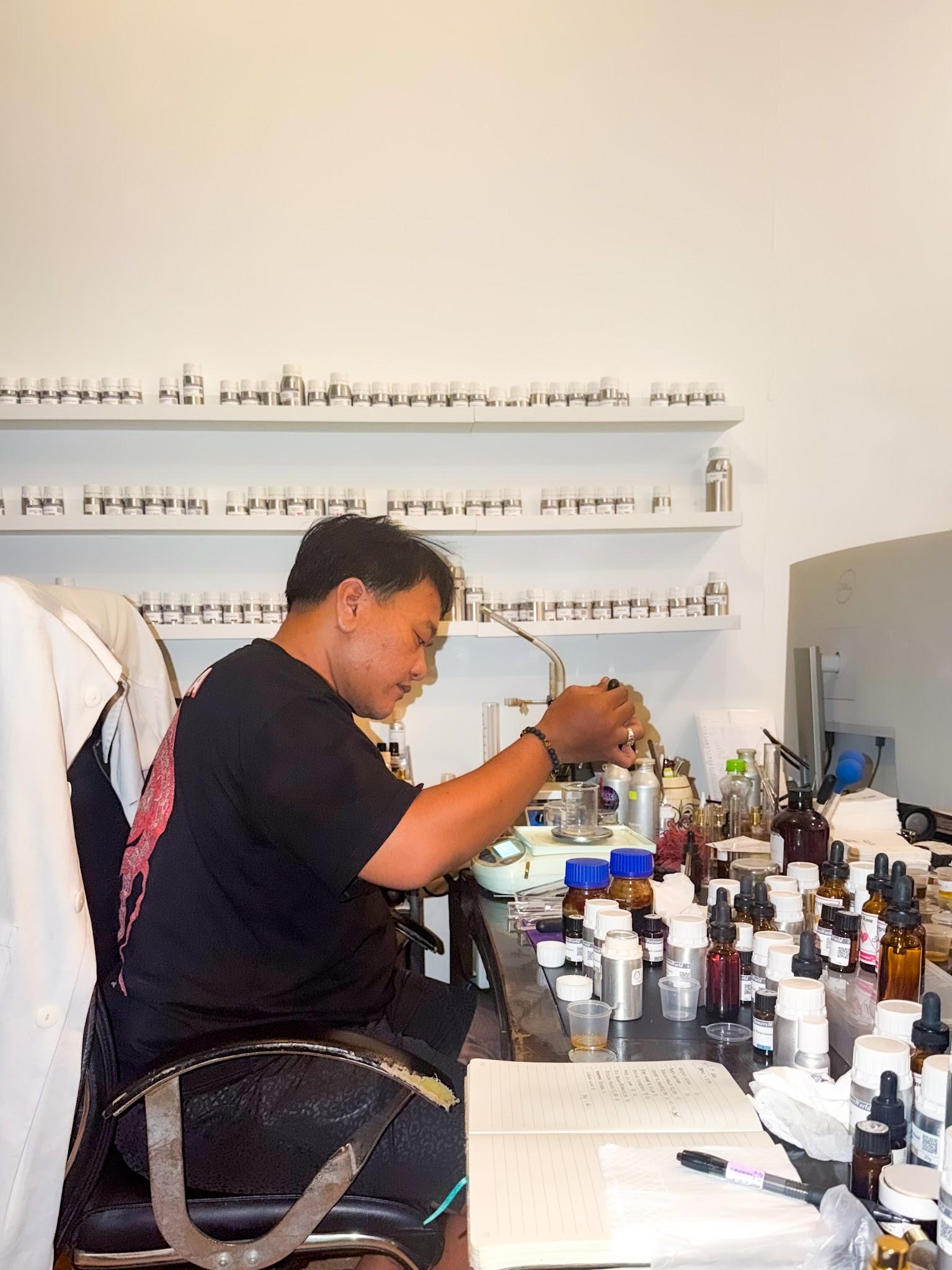 David Germando composing fragrance in his laboratory