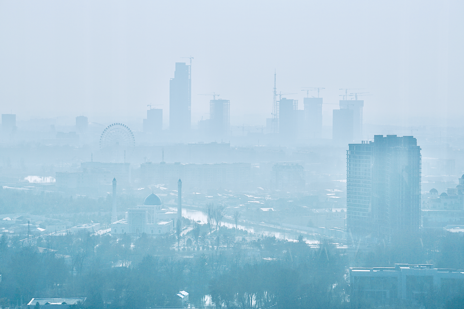A city skyline dimmed by haze