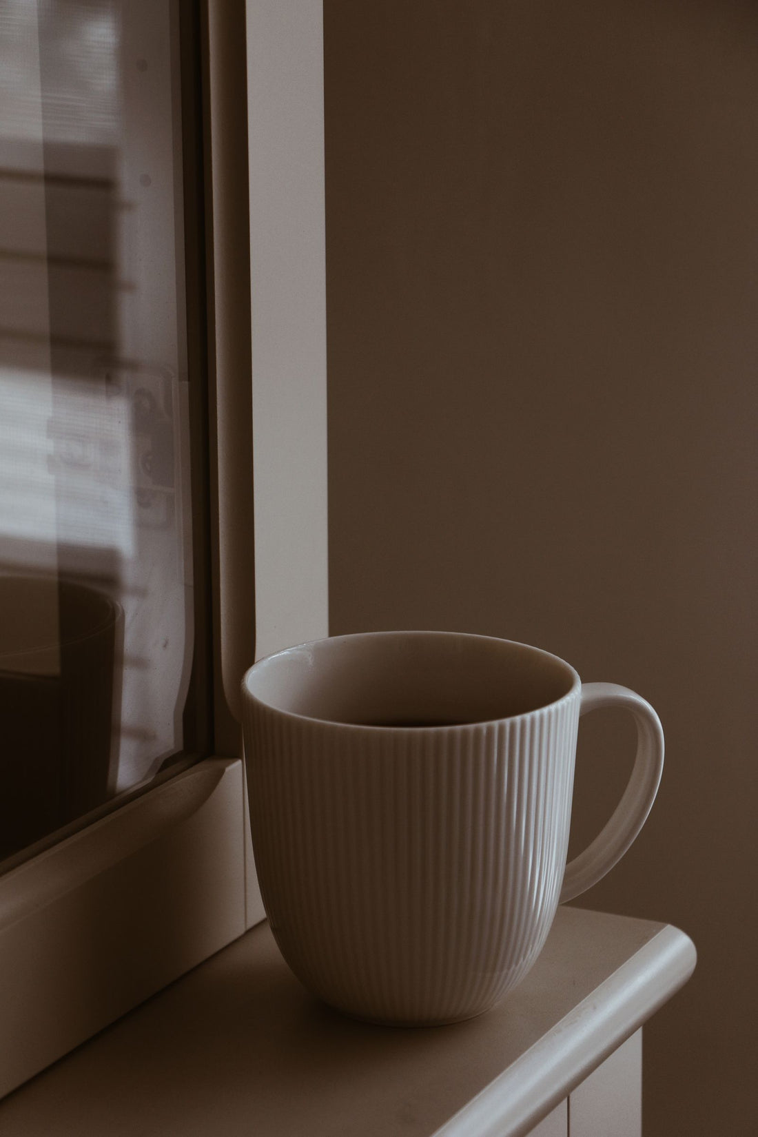 Morning coffee by a window sill