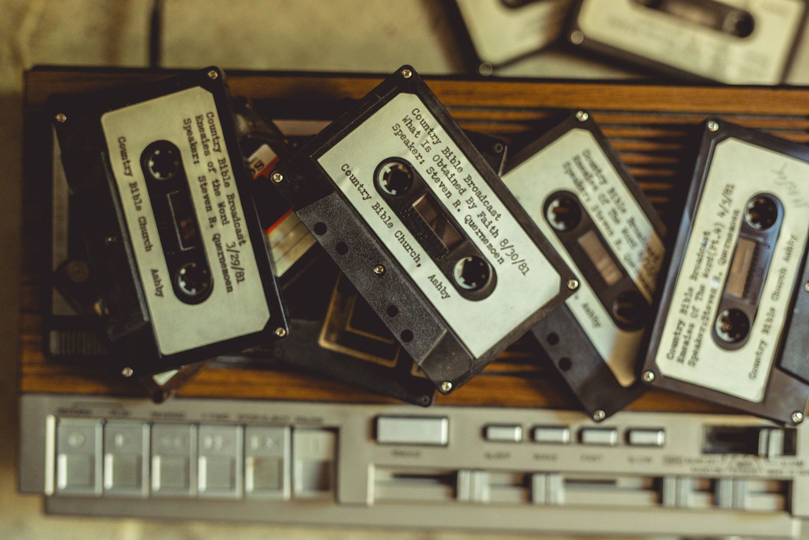 Vintage cassette tapes arranged on a retro player
