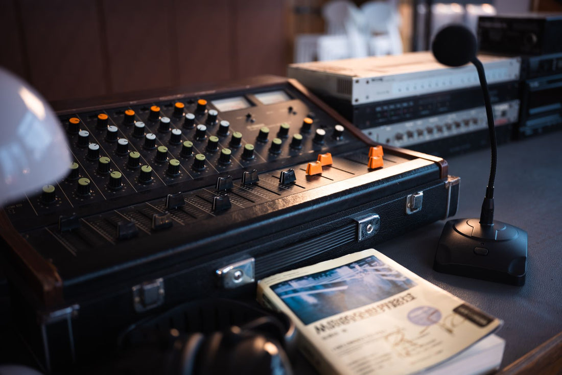 A vintage audio mixer and microphone