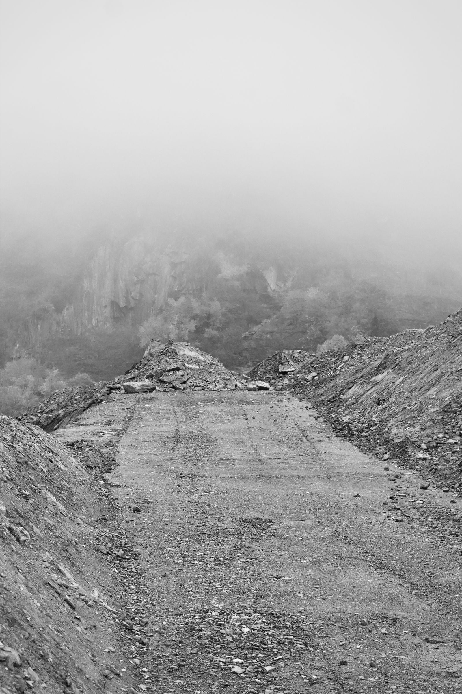 A lonely road through misty mountains