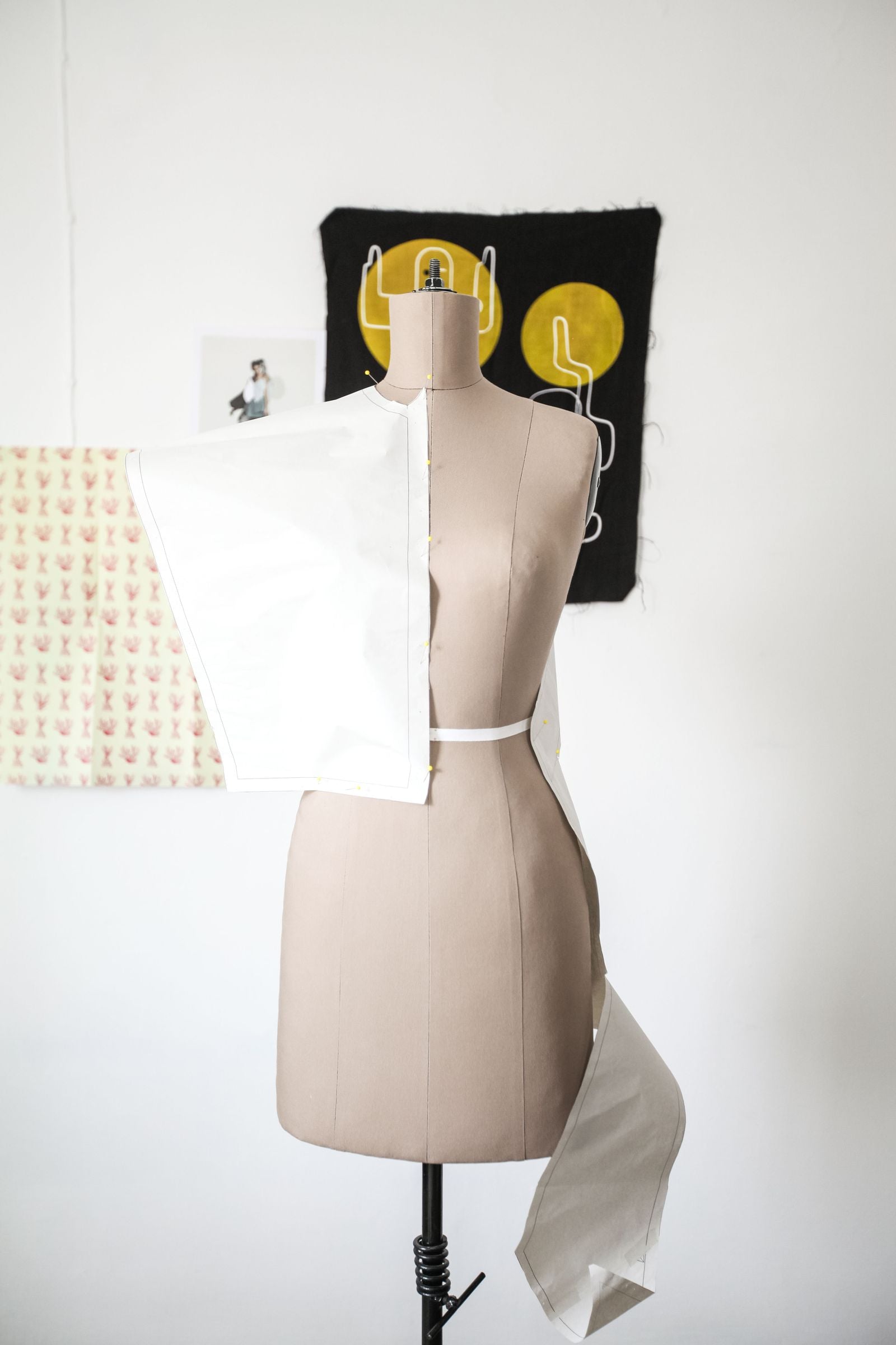White cloth draped on a tailor's mannequin